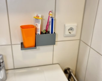 Sistema de almacenamiento de higiene dental para montaje en pared.