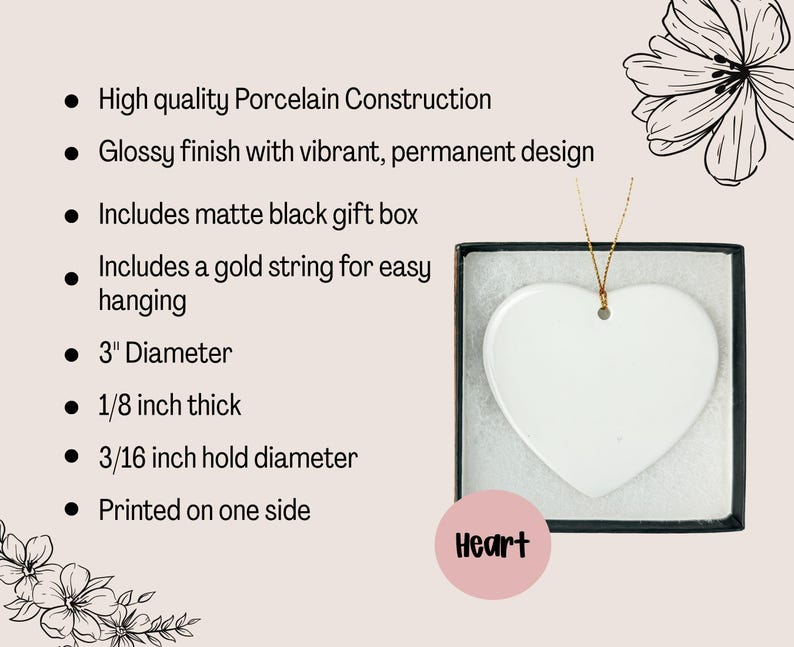 May include: A white heart-shaped porcelain ornament with a glossy finish, presented in a matte black gift box. The ornament has a 3-inch diameter and includes a gold string for hanging. The text "Heart" is on a pink circle.