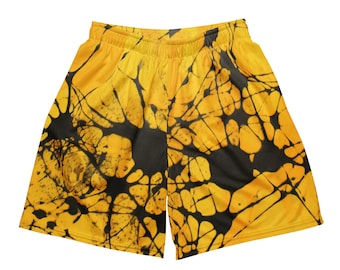 Può includere: Pantaloncini sportivi gialli con un motivo tie-dye nero.