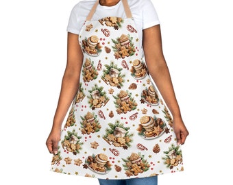 May include: A white apron with a Christmas cookie pattern. The apron features gingerbread men, candy canes, pine cones, and stars. The apron has adjustable straps.