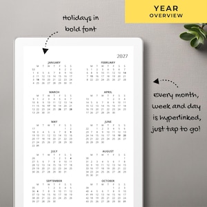 May include: A digital 2027 year overview calendar displayed on a tablet screen. The calendar features months from January to October with dates arranged in a grid. Text includes 'YEAR OVERVIEW', 'holidays in bold font', and 'Every month, week and day is hyperlinked, just tap to go!'