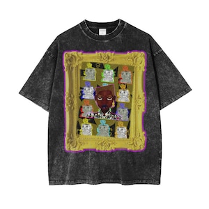 May include: A black t-shirt with a vintage look featuring a gold frame with a colourful portrait of a person inside. The portrait is surrounded by smaller images of robots.