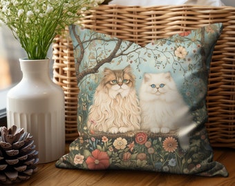 May include: A decorative throw pillow with a whimsical illustration of two white Persian cats sitting in a garden setting. The cats have blue eyes and are surrounded by colorful flowers and foliage. The background is a soft blue with a delicate floral pattern.