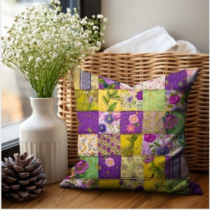 May include: A purple, yellow, and green patchwork pillow with a floral design. The pillow is sitting on a wicker basket.