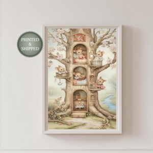 May include: A framed watercolor print of a treehouse with several mouse characters in their homes. The artwork has a soft color palette with pink blossoms and a small stream. The print is displayed on a white wall.