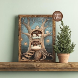 May include: A framed print of a whimsical treehouse scene. The artwork features a large tree with owl inhabitants in cozy, book-filled rooms. The print is in a wooden frame and sits on a wooden shelf with a small potted evergreen tree.