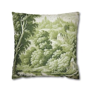 May include: Green and white throw pillow with a scenic landscape design featuring a small house, trees, and a river.