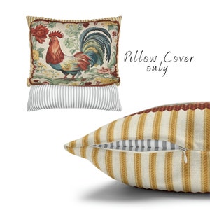 May include: A pillow cover featuring a colorful rooster with a red comb and a floral background. The cover has a zipper closure and a striped pattern on the back.