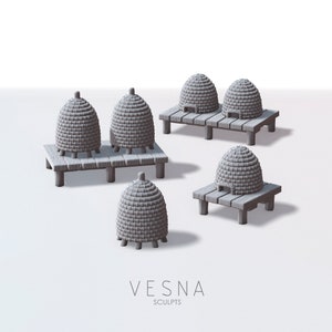 May include: Five gray wooden beehive structures with thatched roofs on wooden platforms. The beehives are arranged in a staggered pattern on a white background. The text "VESNA SCULPTS" is printed below the beehives.