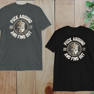 two t - shirts on a wooden background
