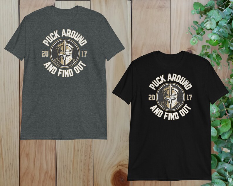 two t - shirts on a wooden background