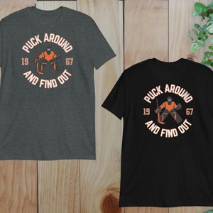 two t - shirts on a wooden background