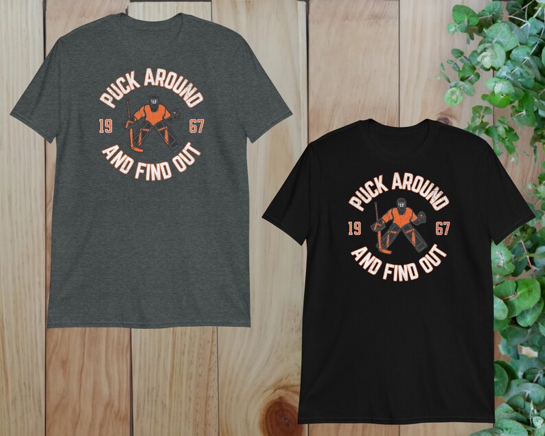two t - shirts on a wooden background