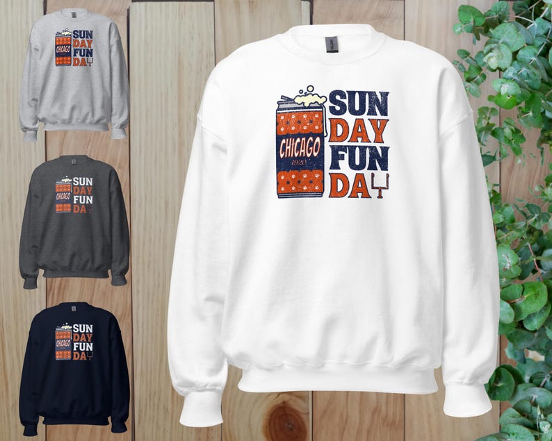 May include: White sweatshirt with the text "SUN DAY FUN DAY" in blue and red. The design includes a graphic of a can with the text "CHICAGO" and a football field. Three other sweatshirts in gray, charcoal, and navy are also shown.