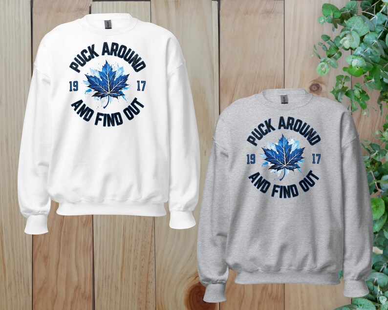 two sweatshirts with the words puck around and find out on them