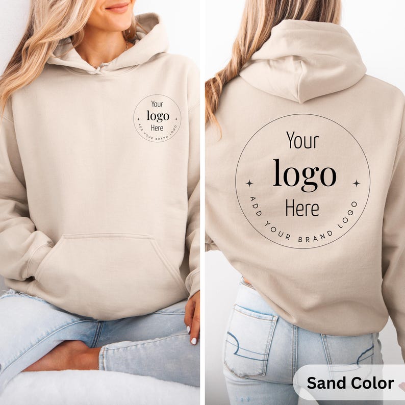 May include: Sand-colored hoodie with a front pocket and drawstring hood. The front and back of the hoodie feature a circular design with the text "Your logo Here" and "Add your brand logo". The bottom right corner of the image has the text "Sand Color".