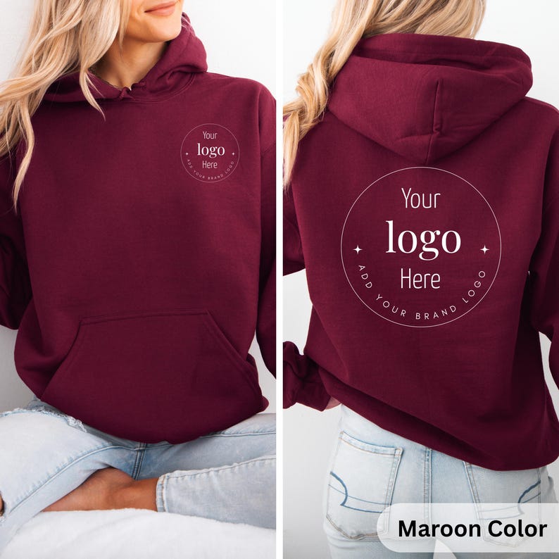 May include: Maroon-colored hoodie with a front pocket and hood. The front and back of the hoodie feature a circular design with the text "Your logo Here". The bottom right corner of the image has the text "Maroon Color".