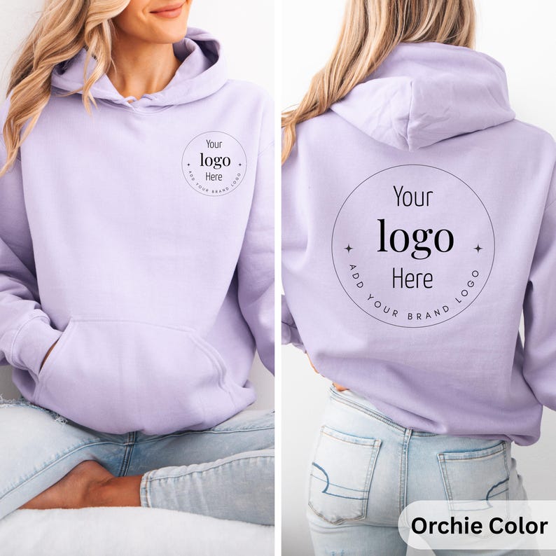 May include: A light purple hoodie with a front pocket and hood. The front and back of the hoodie feature a circular design with the text "Your logo Here" and "Add your brand logo". The hoodie is a solid color and is labeled "Orchie Color".