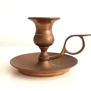 May include: A set of three ceramic mugs with a speckled, matte finish in cream, light grey, and dark grey. Each mug has a simple, minimalist design, suitable for coffee or tea.