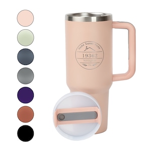 May include: A pink stainless steel travel mug with a black handle and lid. The mug has a silver inscription that reads "Home Sweet Home 19362 Nottinghamshire Est. 1914".