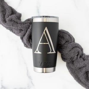 Yeti Rambler 20oz Tumbler with MagSlider Lid in Black with Monogram. Flat lay.
