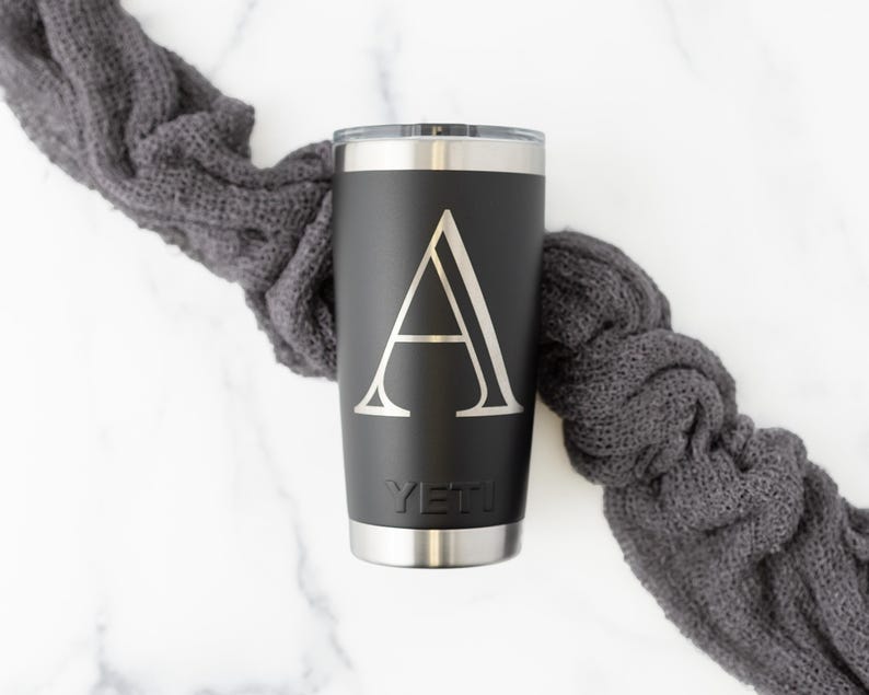 Yeti Rambler 20oz Tumbler with MagSlider Lid in Black with Monogram. Flat lay.