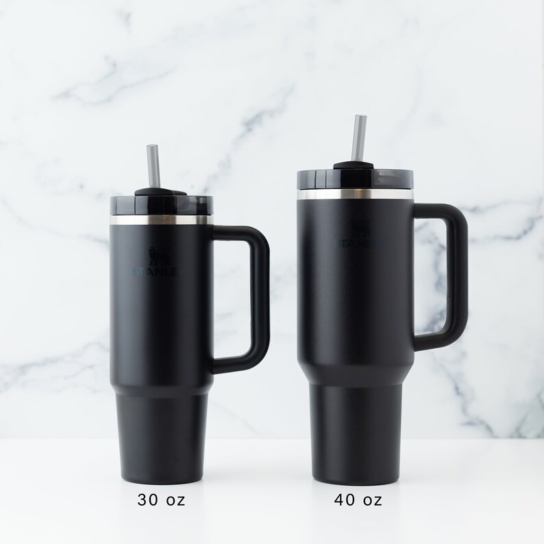 Stanley 40 oz and 30 oz tumblers in black shown together for size comparison.