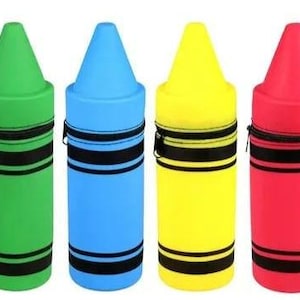 May include: Four cylindrical cases shaped like crayons in green, blue, yellow, and red. Each case features a pointed top, a black zipper closure, and two horizontal black stripes encircling the body. The design mimics the appearance of a standard wax crayon.