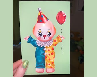 May include: A green card with a cartoon illustration of a clown with a red, white, and blue hat, a blue and yellow costume, and a red balloon. The clown has a white collar and red polka dots on the yellow part of the costume.