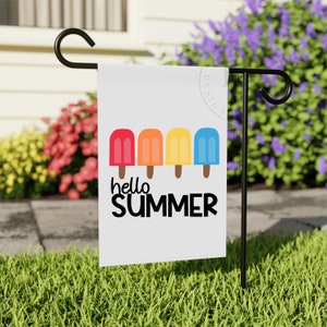May include: A white garden flag with a colorful popsicle design and the text "hello summer".