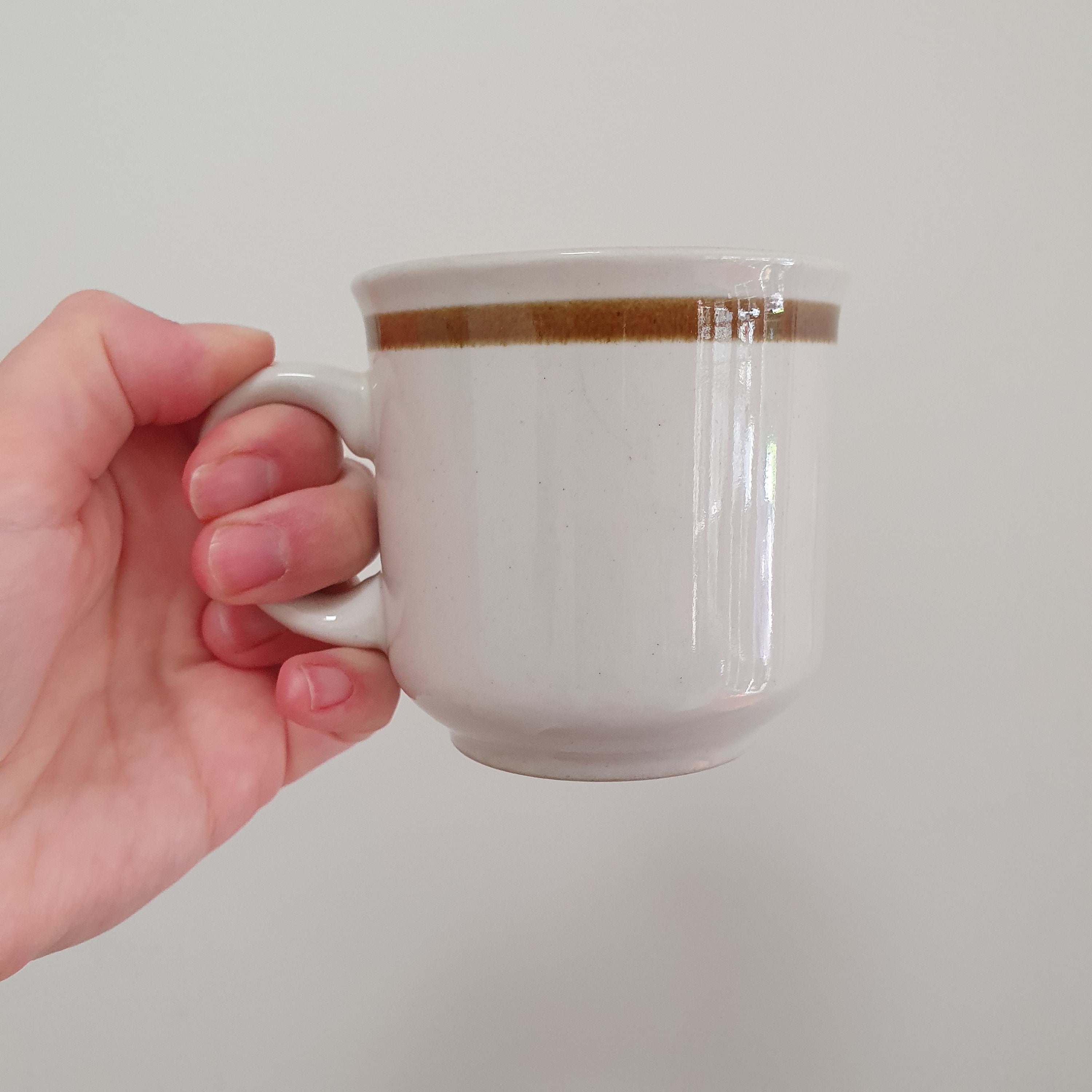 A Set of 4 Genuine Stoneware Coffee Mugs Teacups and Saucers