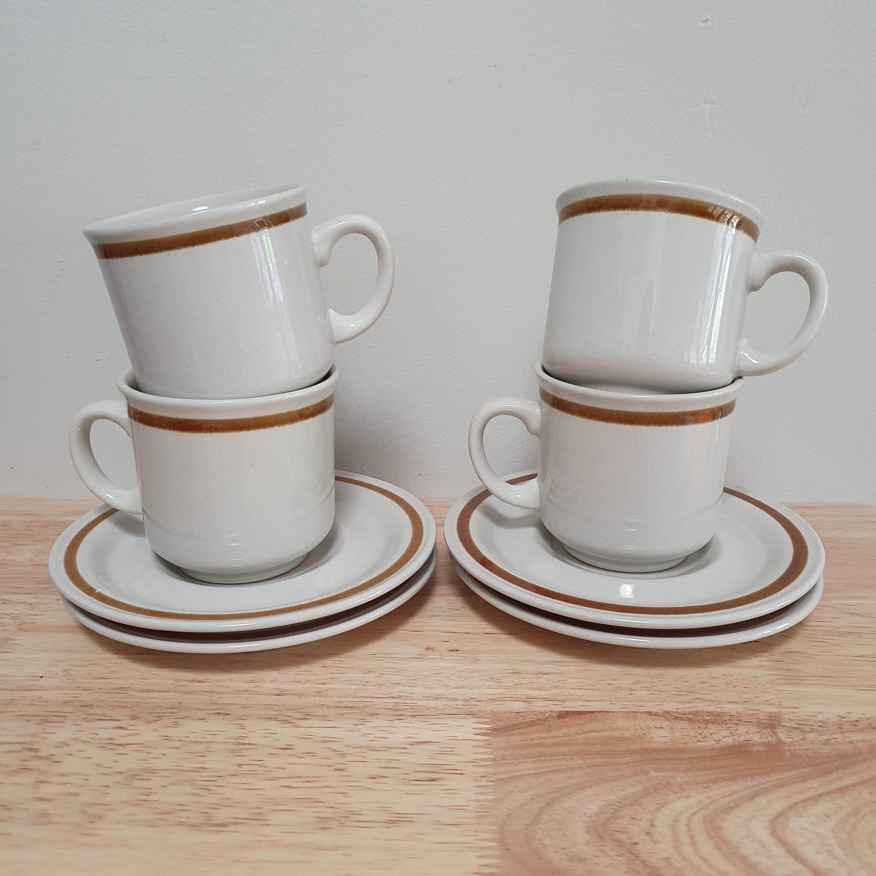 A Set of 4 Genuine Stoneware Coffee Mugs Teacups and Saucers