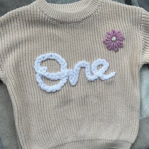 Searching for a memorable and meaningful first birthday present? Our embroidered cream one jumper is the perfect gift to celebrate this special milestone. A keepsake that will be cherished for years to come.