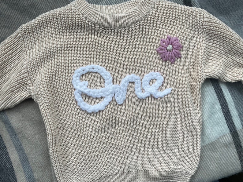 Searching for a memorable and meaningful first birthday present? Our embroidered cream one jumper is the perfect gift to celebrate this special milestone. A keepsake that will be cherished for years to come.