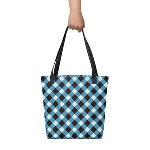 May include: A blue and black checkered tote bag with black handles.
