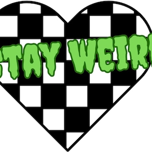 May include: A black and white checkered heart with the words "STAY WEIRD" in green dripping letters.