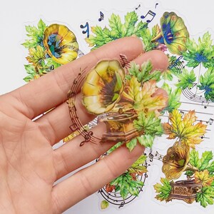 10 pegatinas musicales. Paquete de pegatinas con notas musicales en forma de hojas. Estuche transparente para violonchelo, Kindle, decoración para teléfono o para álbumes de recortes, diarios y planificadores. Reino Unido.