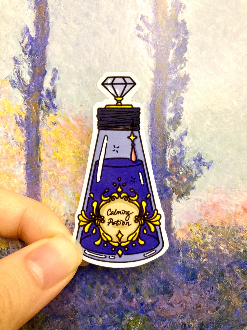 May include: A blue glass bottle with a diamond stopper and a gold label that reads "Calming Potion".
