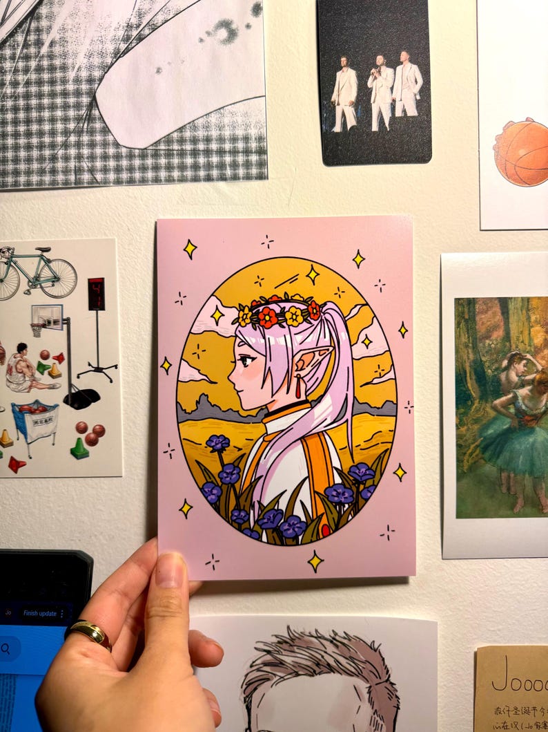 May include: A pink and yellow illustration of a female elf with long purple hair wearing a white and orange outfit. She is wearing a flower crown and standing in a field of flowers. The background is a sunset sky with clouds.
