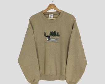 vintage des années 90 canard graphique marron sweat grand canard animal pull Duck Lake faune ras du cou canard Habitat pull canard pull taille L
