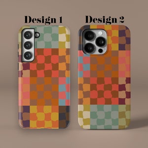 May include: Two phone cases with a colorful geometric pattern. The pattern is made up of squares and rectangles in shades of orange, red, yellow, green, and blue. The cases are labeled "Design 1" and "Design 2".