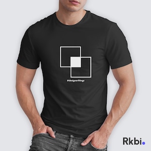 May include: Black t-shirt with a white graphic of two overlapping squares. The text '#designerthings' is printed below the graphic.