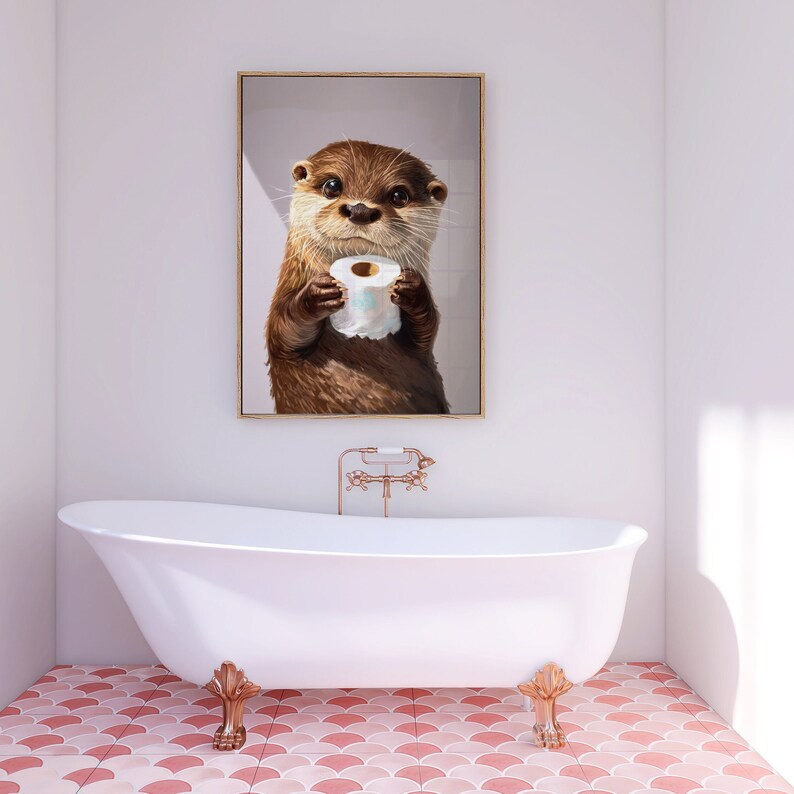 May include: A framed wall art print featuring a brown otter holding a roll of white toilet paper. The otter has dark eyes, a wet nose, and detailed fur texture. The artwork is displayed in a vertical orientation with a thin gold-colored frame.