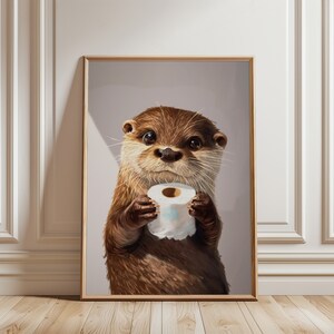 May include: A framed wall art print featuring a brown otter with dark eyes and whiskers holding a white roll of toilet paper. The otter has detailed fur texture and is centered in the frame against a solid light gray background.