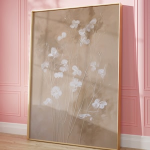 May include: A framed canvas print with a beige background and white flowers. The flowers are painted in a realistic style and have a soft, delicate look.
