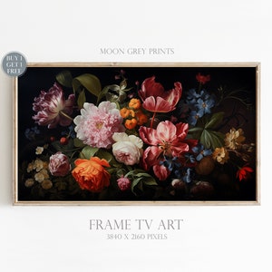 May include: A digital art print of a still life featuring a bouquet of colourful flowers, including pink peonies, red tulips, orange roses, and blue forget-me-nots, against a dark background. The print is framed in a light wood frame. The text "MOON GREY PRINTS" and "FRAME TV ART 3840 X 2160 PIXELS" is visible below the image.