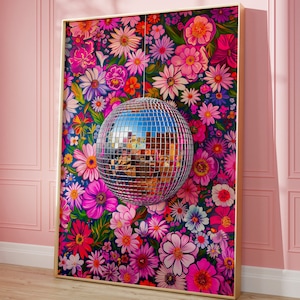 May include: A rectangular framed wall art piece featuring a vibrant, dense pattern of pink, purple, and red flowers on a dark blue background. A reflective, spherical disco ball with a grid of mirrored squares hangs centrally over the floral print.