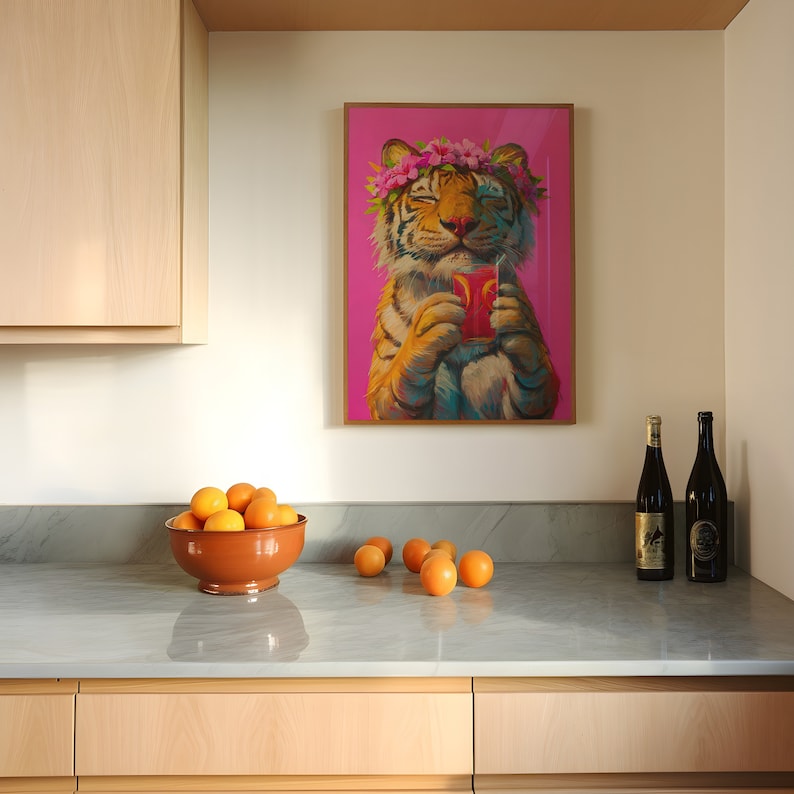 May include: A framed wall art print featuring a tiger wearing a pink flower crown and holding a red drink with a straw against a vibrant pink background. The tiger has orange and black fur and is depicted with its eyes closed in a relaxed expression.