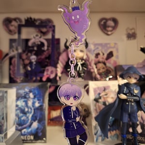 Könnte beinhalten: Ein Set aus drei Keramikbechern mit gesprenkelter, matter Oberfläche. Die Becher sind in Creme-, Hellgrau- und Dunkelgrautönen gehalten. Jeder Becher hat ein schlichtes, minimalistisches Design.