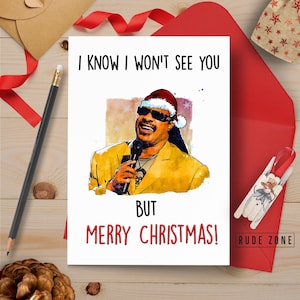May include: A Christmas card featuring a cartoon illustration of a man wearing a Santa hat and sunglasses. The text on the card reads "I know I won't see you but Merry Christmas!"